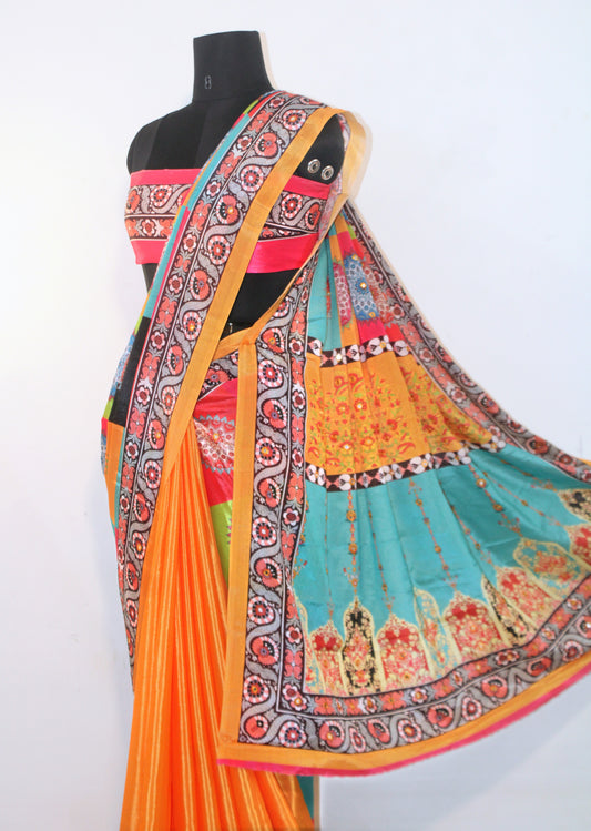 Close-up of mirror work on marigold yellow Chinon silk saree—highlighting artisanal sparkle and intricate craftsmanship.