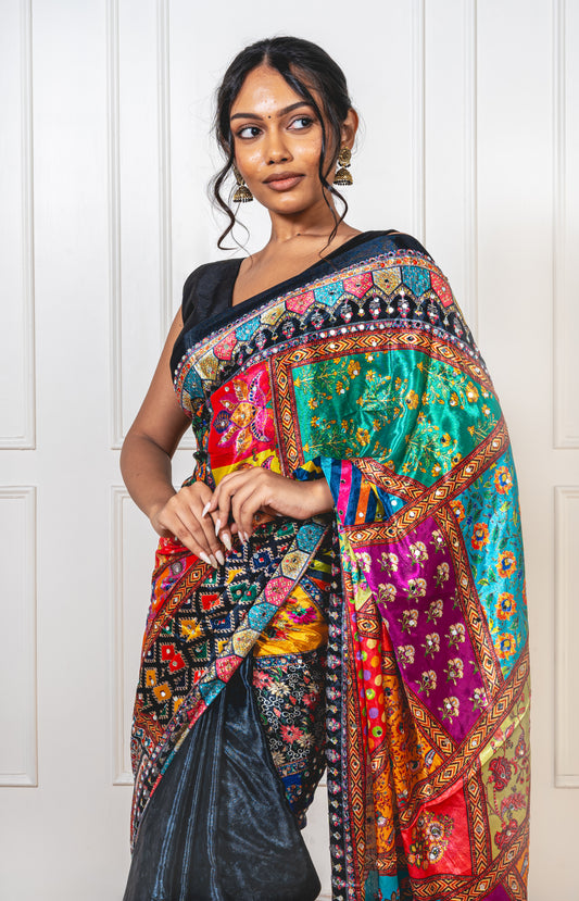 Close-up of mirror work on raven black Chinon silk saree—highlighting artisanal sparkle and intricate craftsmanship.