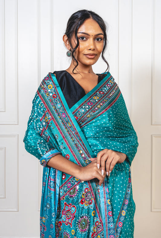 Close-up of mirror work on Tiffany blue Chinon silk saree—highlighting artisanal sparkle and delicate craftsmanship.