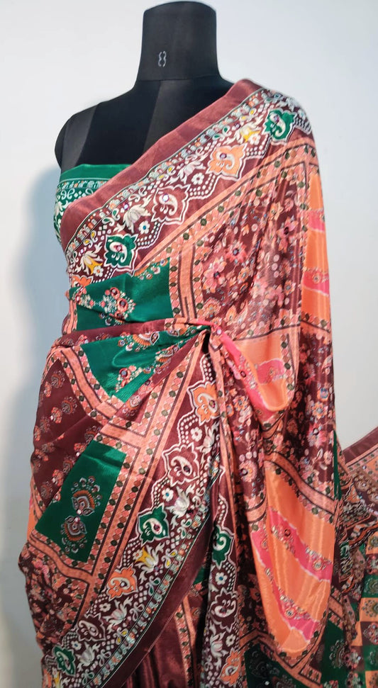 Close-up of mirror work on brown Chinon silk saree—highlighting artisanal sparkle and intricate craftsmanship.