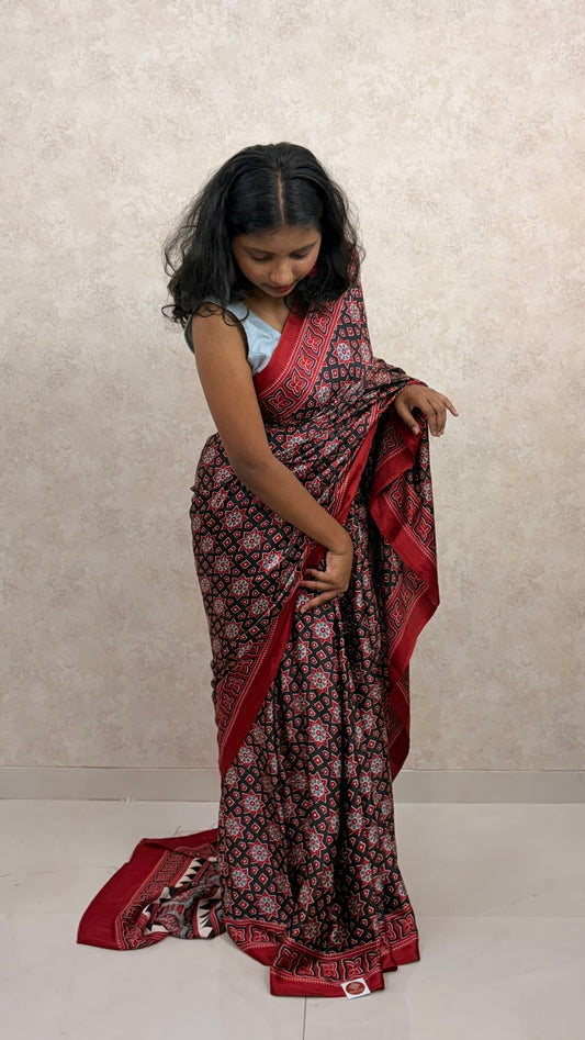 Female model wearing twilight-toned Modal Silk Saree with Ajrakh block prints