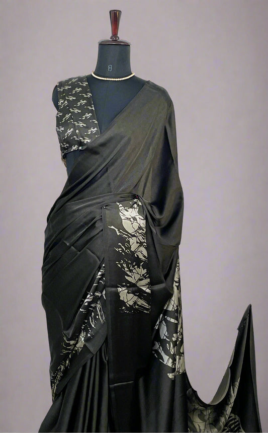 Close-up of silver abstract print on black Modal silk saree—highlighting artistic shimmer and fine craftsmanship