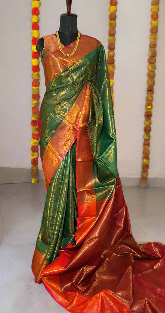 Mannequin wearing Mysore semi silk green saree with golden zari and red border—styled for weddings, festive rituals, and traditional celebrations.