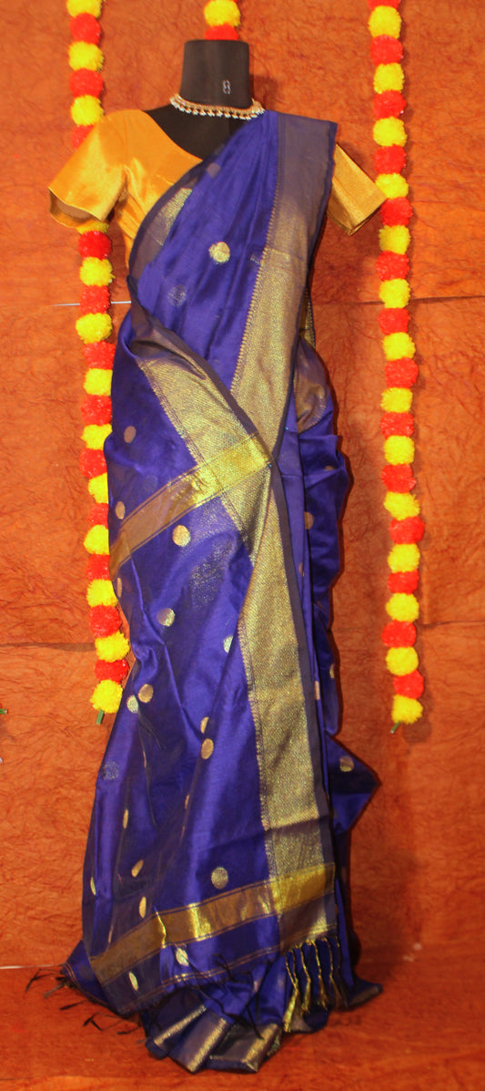 Blue Maheshwari cotton silk saree with signature zari border and pallu—capturing regal contrast and woven elegance.