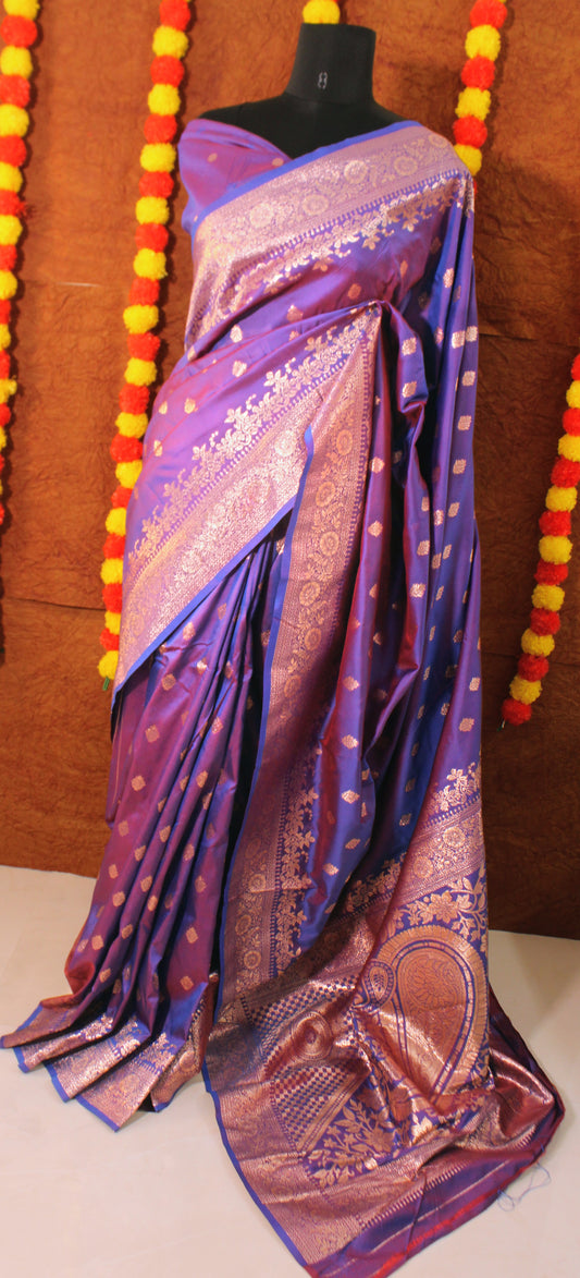 Banarasi Semi Silk saree displayed flat, showcasing intricate zari weaves and broad traditional borders—crafted for regal celebrations.