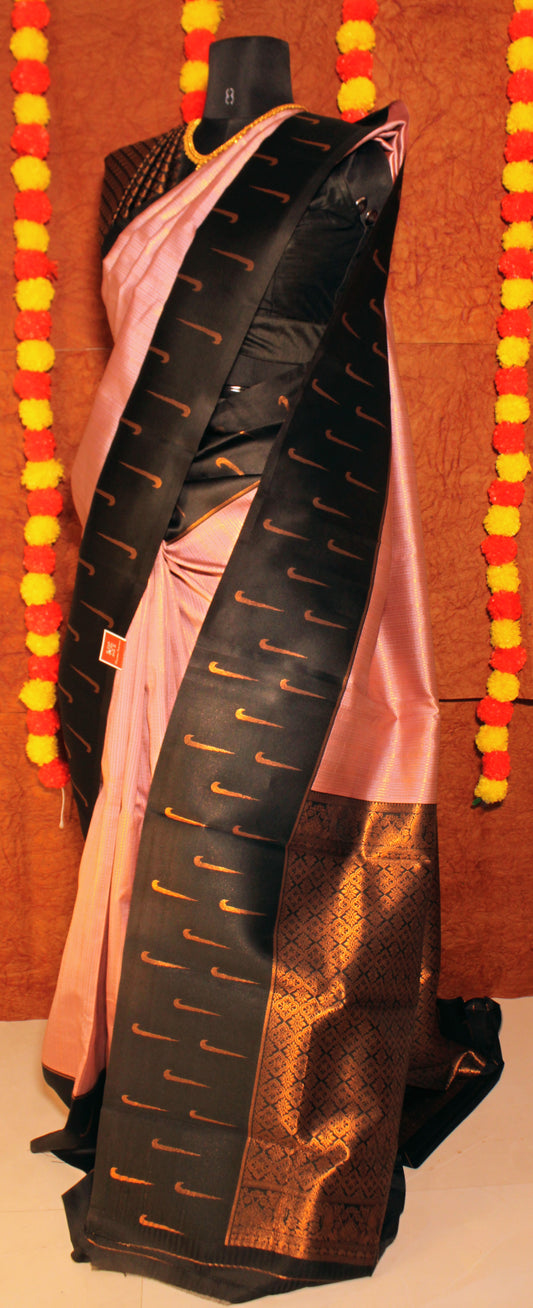 Semi Kanchi silk saree with Muniya butta border and contrast pallu laid flat—showcasing traditional motifs and vibrant color play.