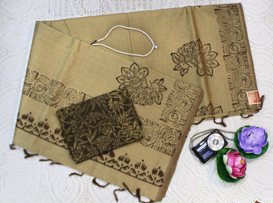 Elegant semi-silk saree in light green featuring traditional block patterns