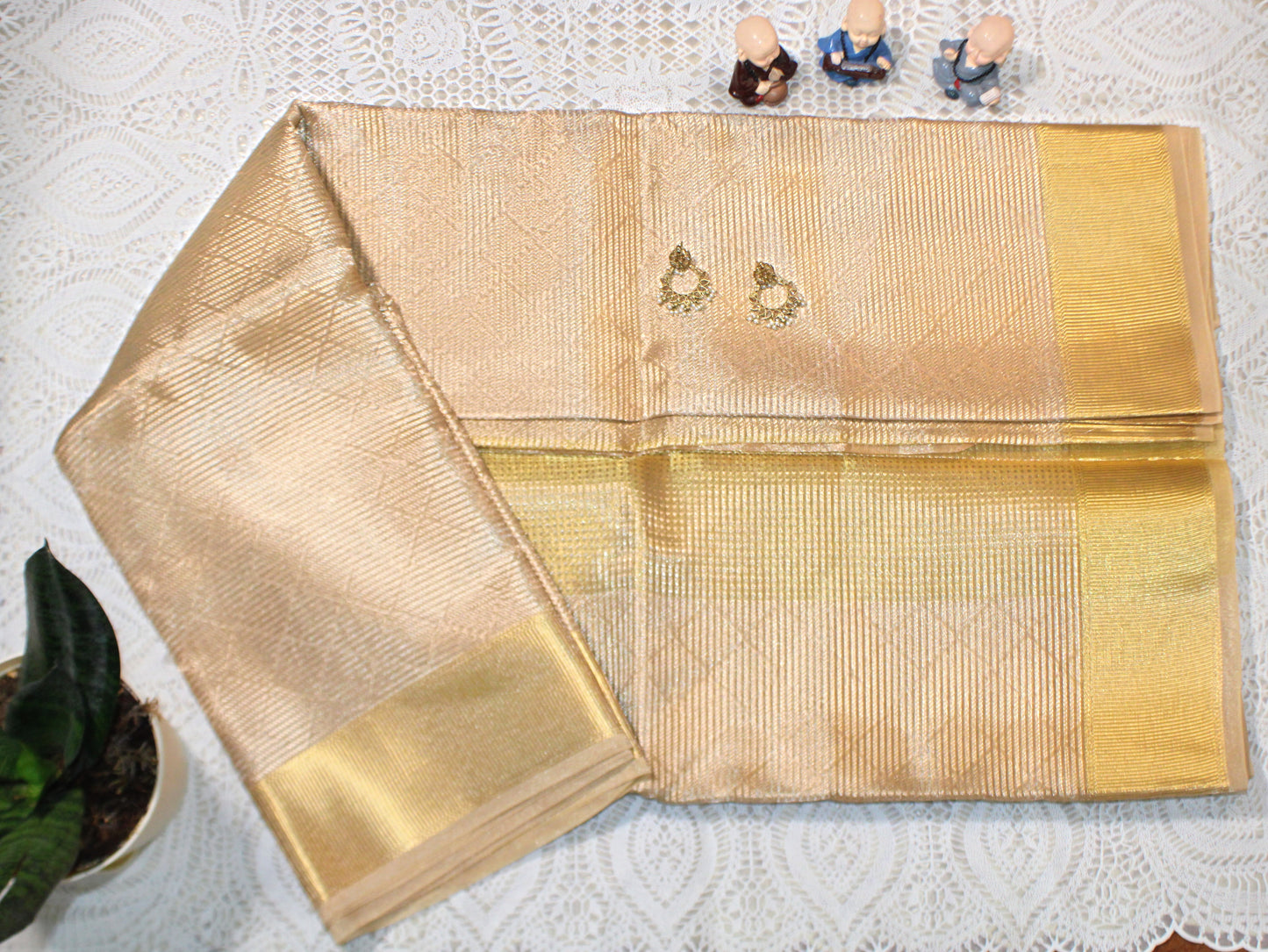 Gold saree with elegant pleats and glowing pallu—evoking Jyothika’s luminous charm and festive grandeur.
