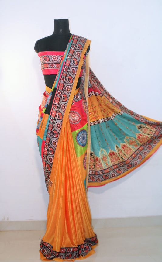 Mannequin wearing marigold yellow Chinon silk saree with mirror work—styled for Navaratri garba nights, pujas, and festive celebrations.