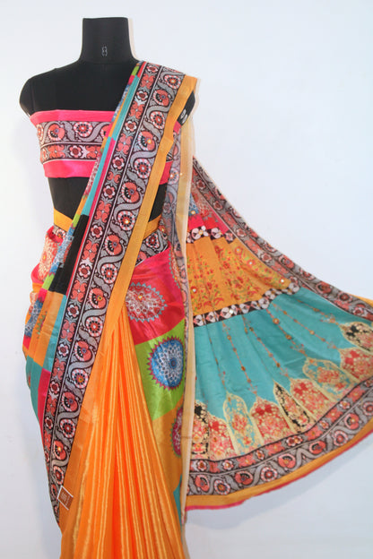 Marigold yellow Chinon silk saree laid flat—featuring shimmering mirror embellishments and soft, flowy texture