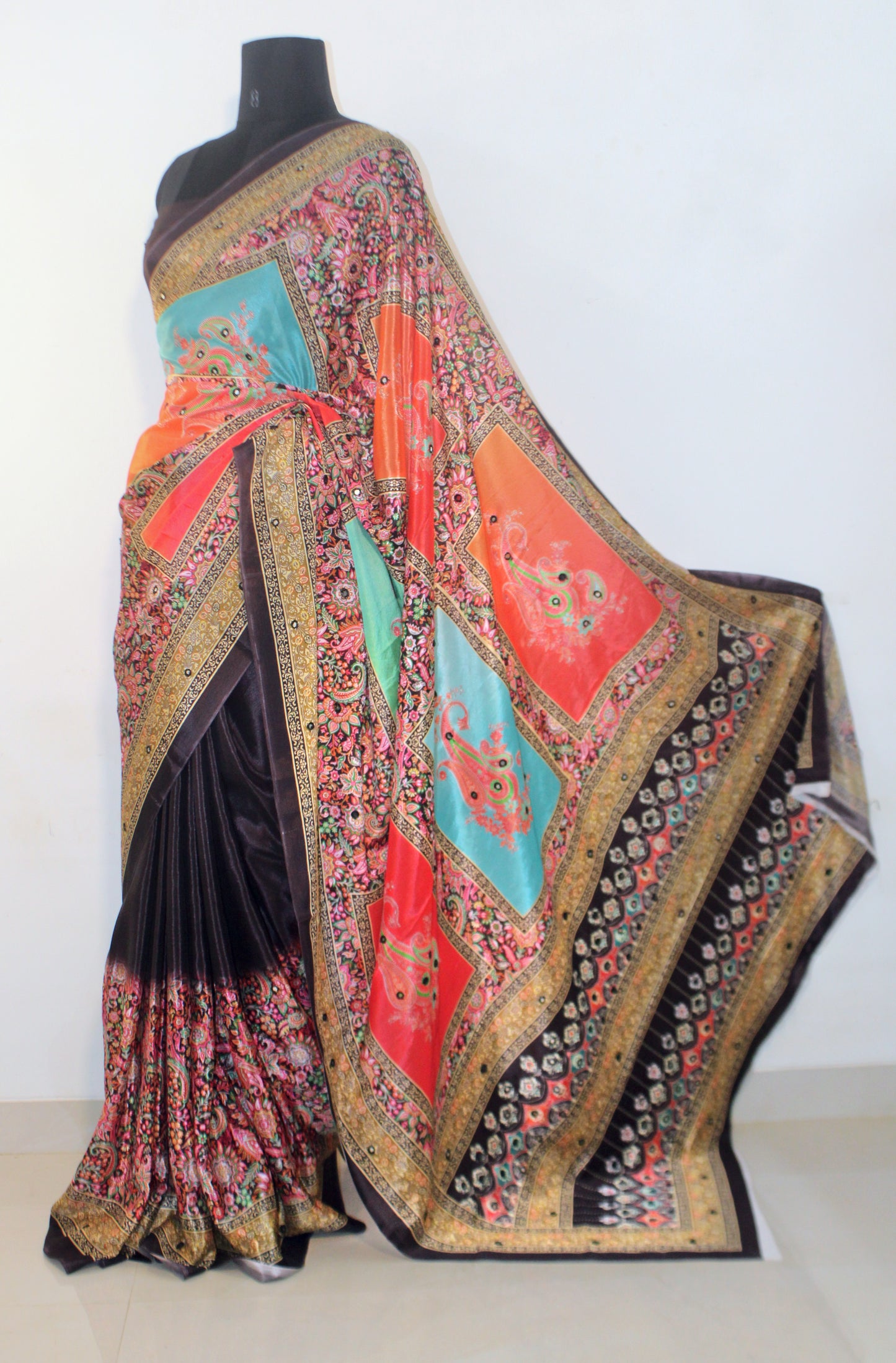 Dark wine Chinon silk saree with mirror-detailed pallu and crisp pleats—capturing festive shimmer and graceful movement.