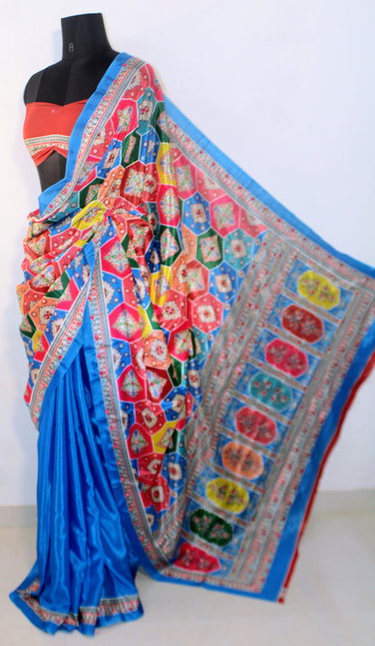 Capri blue Chinon silk saree with mirror-detailed pallu and crisp pleats—capturing festive shimmer and graceful drape.