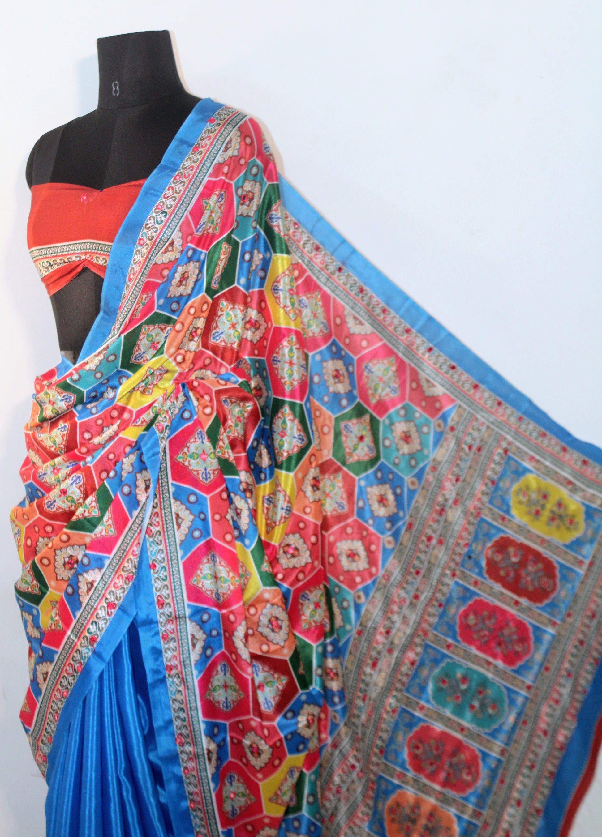 Close-up of mirror work on Capri blue Chinon silk saree—highlighting artisanal sparkle and intricate craftsmanship.