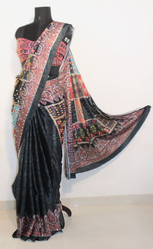 Mannequin wearing stone black Chinon silk saree with mirror work—styled for Navaratri garba nights, pujas, and festive celebrations.
