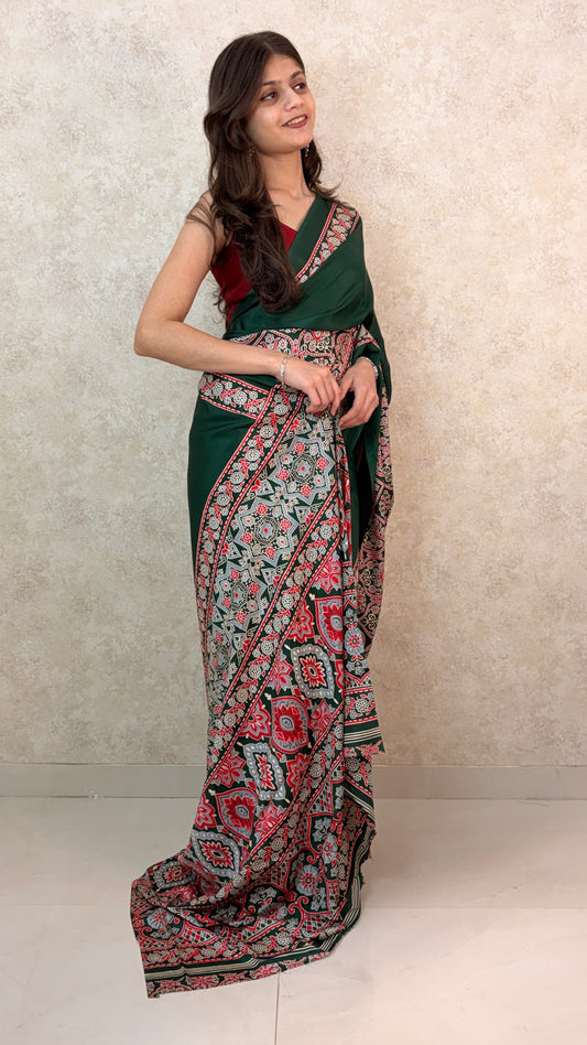 Elegant woman in Modal Silk Saree featuring Ajrakh block prints and luxurious drape