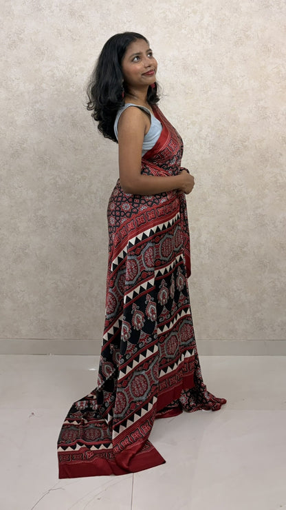 Woman in traditional Ajrakh Modal Silk Saree, styled for festive elegance