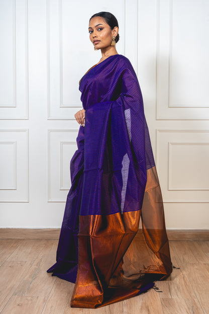 Blue Maheshwari cotton silk saree laid flat—featuring copper zari detailing, lightweight texture, and elegant sheen.