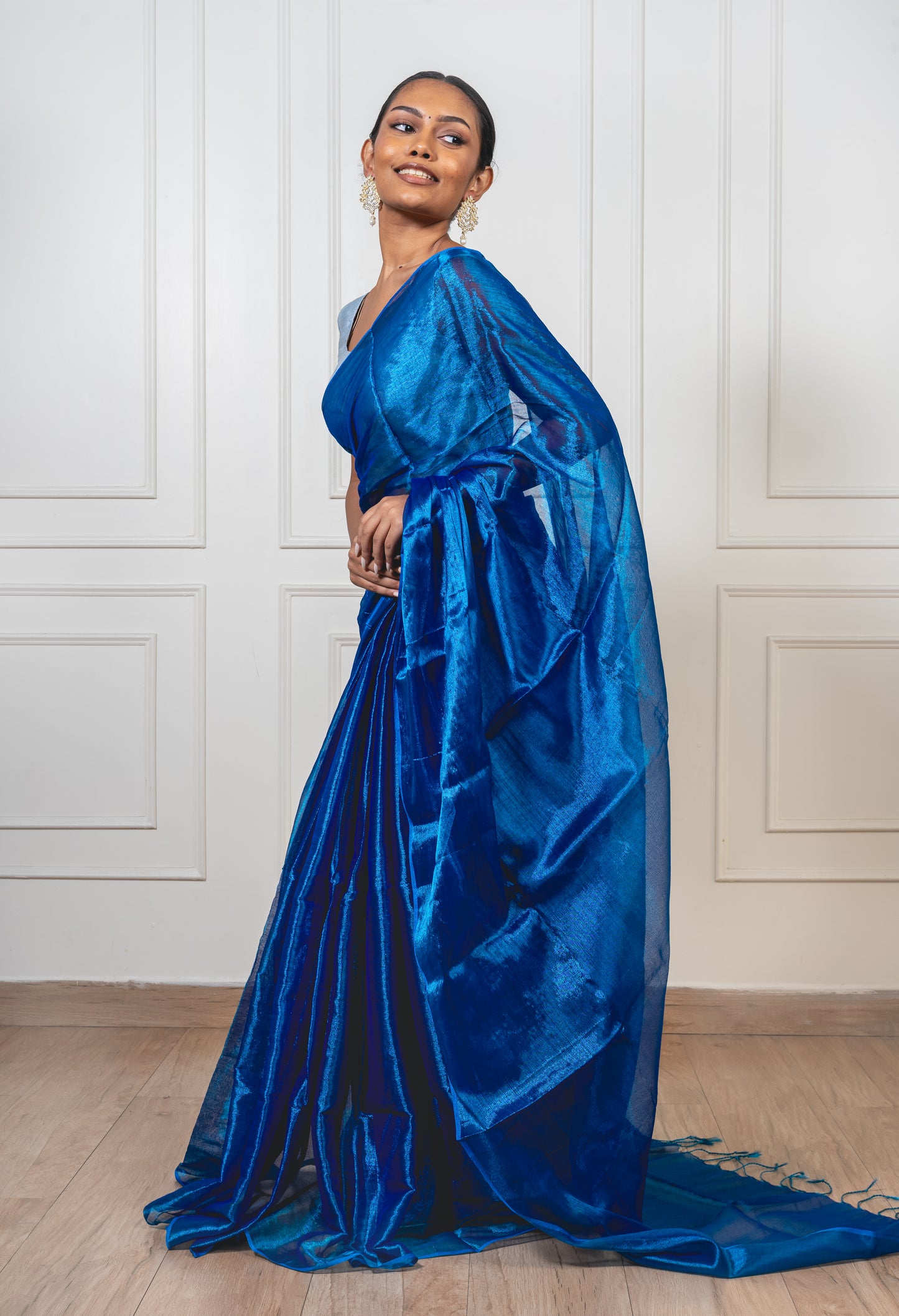 Royal blue tissue silk saree with flowing pallu and radiant finish—evoking regal charm and heirloom elegance.