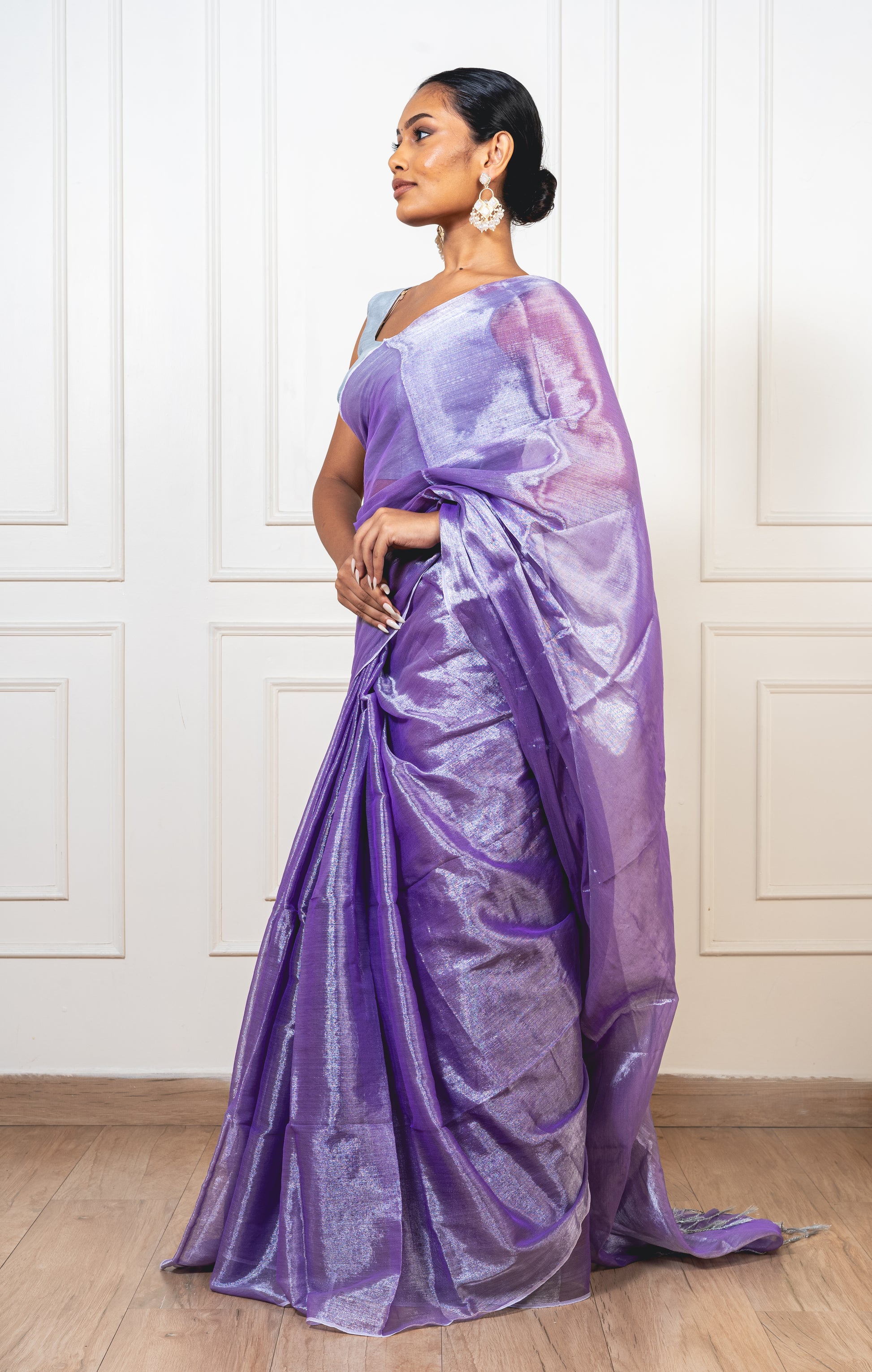 Periwinkle purple tissue silk saree with flowing pallu and radiant finish—evoking twilight softness and heirloom charm.