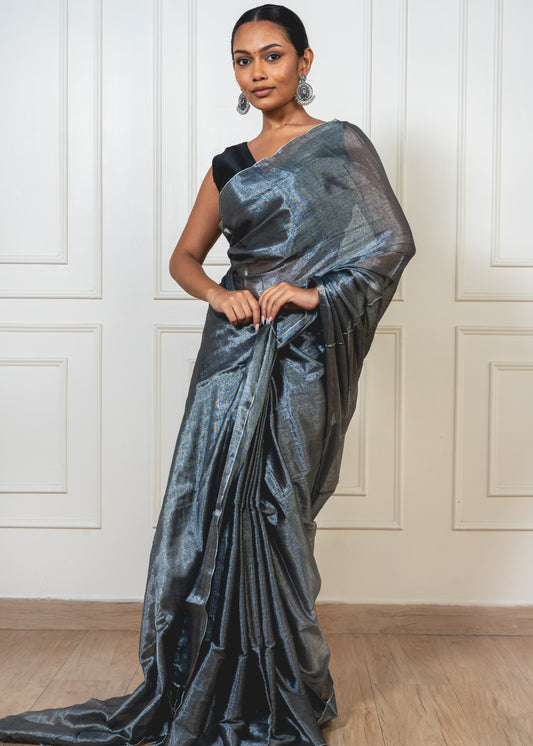Ash Grey Tissue Silk Saree with subtle shimmer, lightweight drape, and festive-ready elegance—styled for tradition and modern grace by Paarmita.