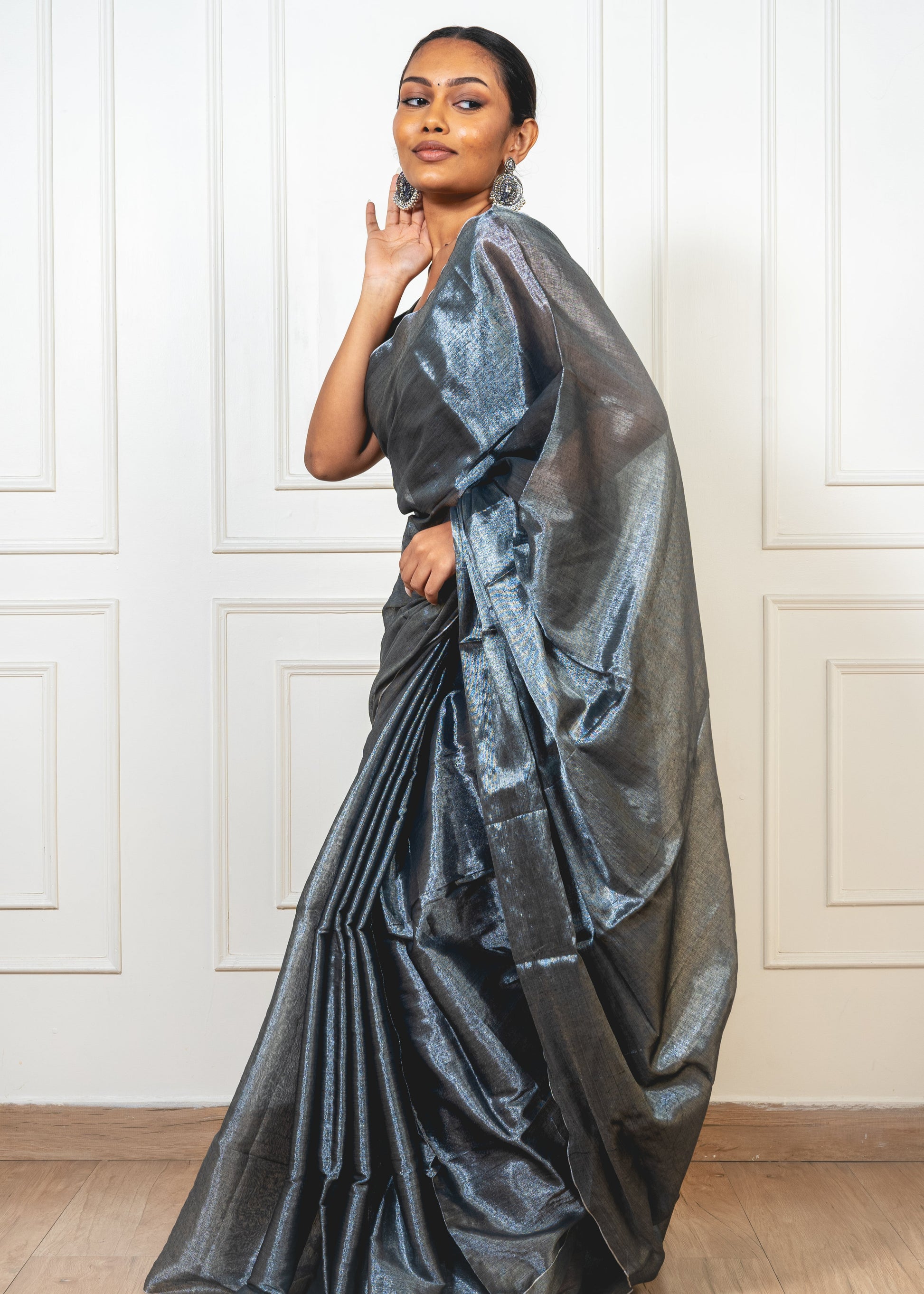 Ash Grey Tissue Silk Saree displayed in flat lay—highlighting its sheer texture, silver undertones, and delicate border.