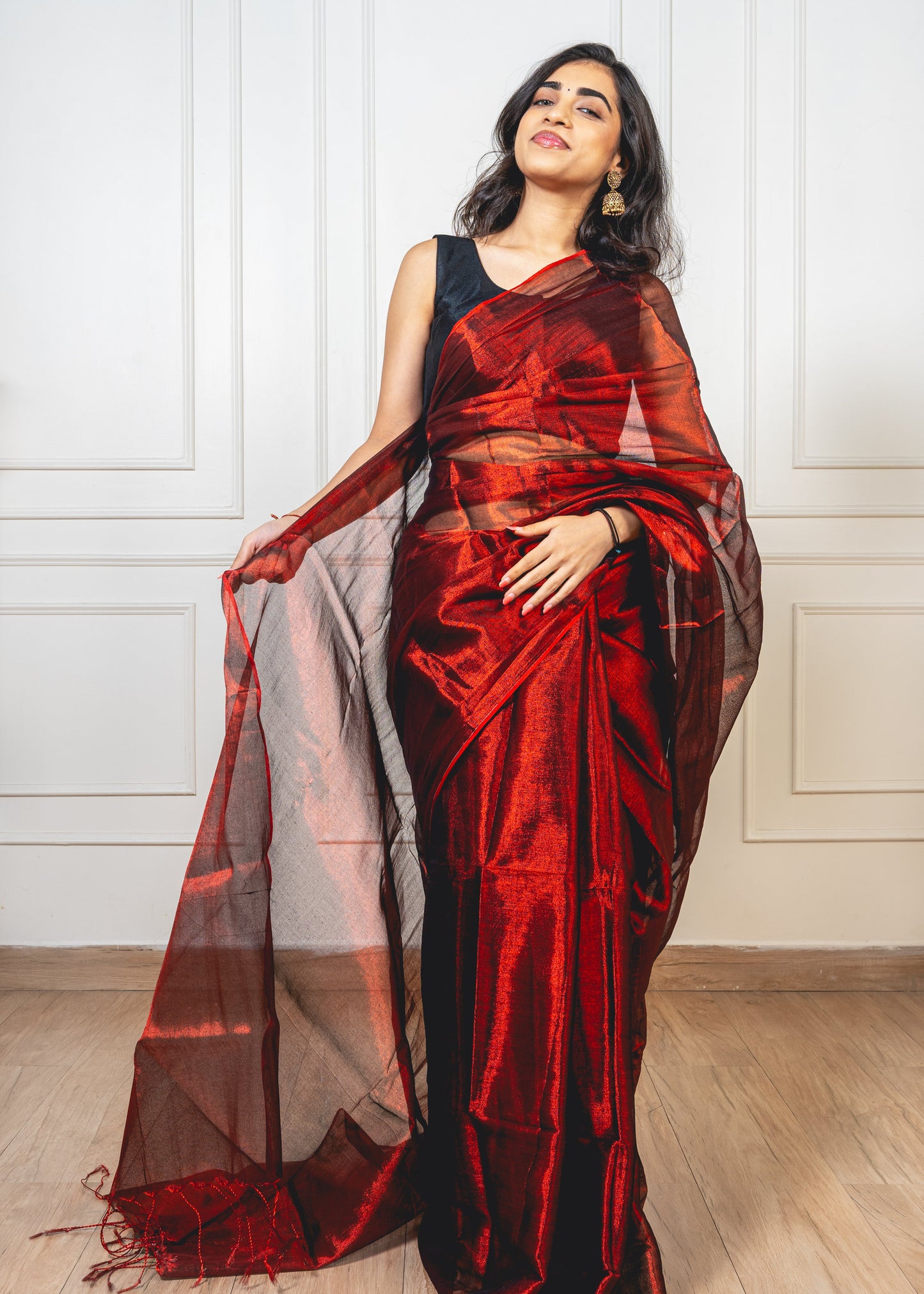 Close-up of royal maroon tissue silk—highlighting shimmering weave and refined craftsmanship.