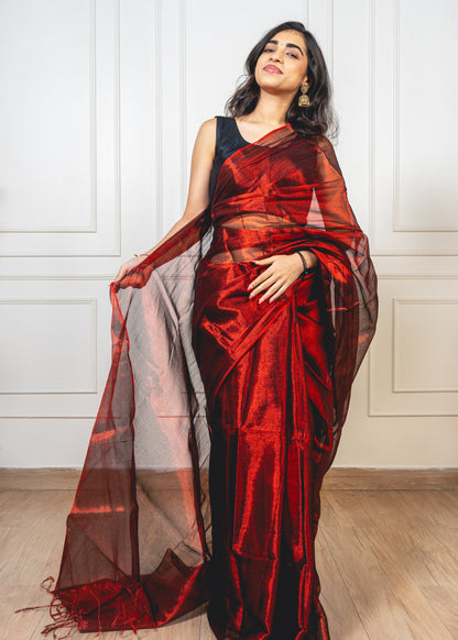 Close-up of royal maroon tissue silk—highlighting shimmering weave and refined craftsmanship.