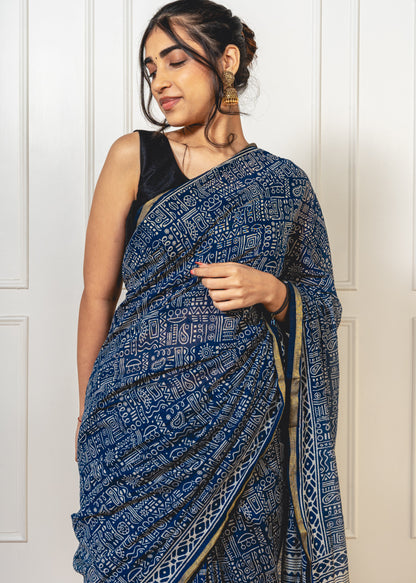 Blue Chanderi saree with Warli-printed pallu—capturing folk-inspired design and lightweight drape.