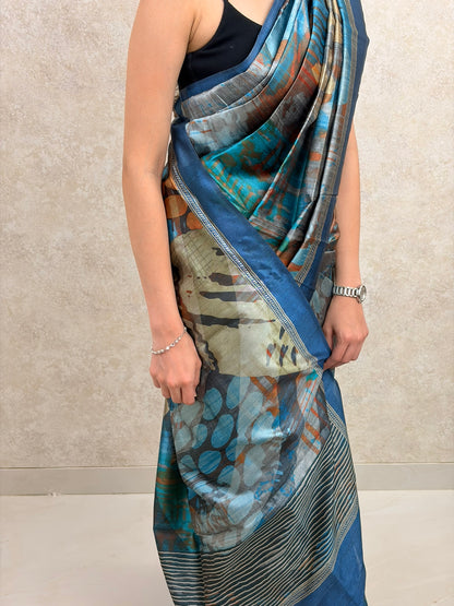 Woman wearing Art Silk Saree with full abstract print, styled for a bold contemporary look