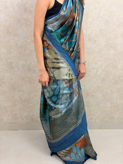 Graceful pose in Art Silk Saree with expressive abstract motifs and rich color palette
