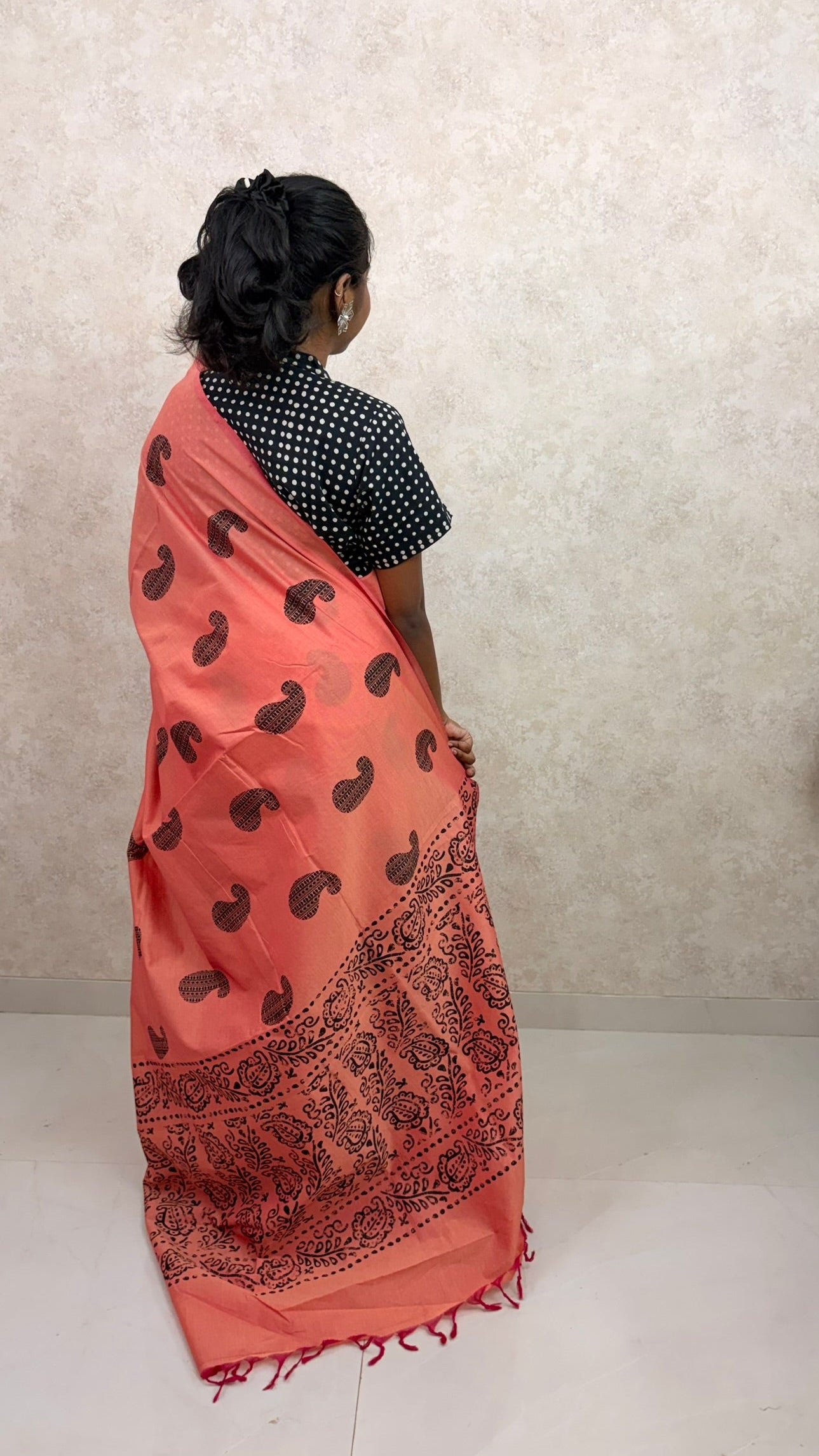 Graceful pose in Cotton Orange Silk Saree with detailed block print design and soft sheen