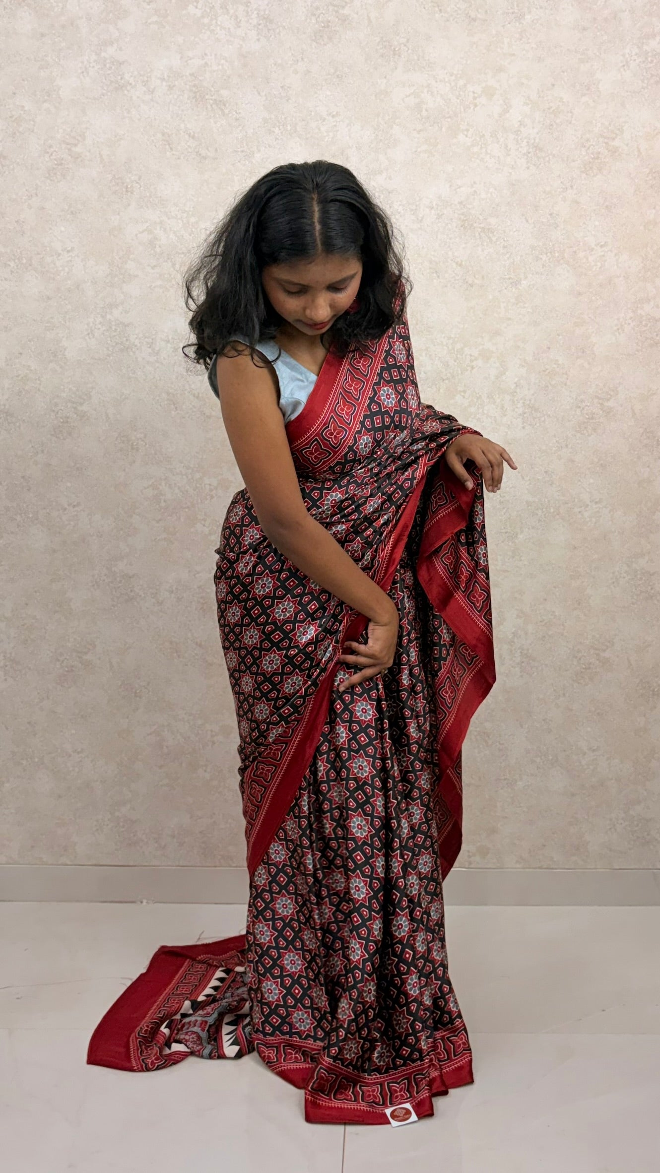 Female model wearing twilight-toned Modal Silk Saree with Ajrakh block prints