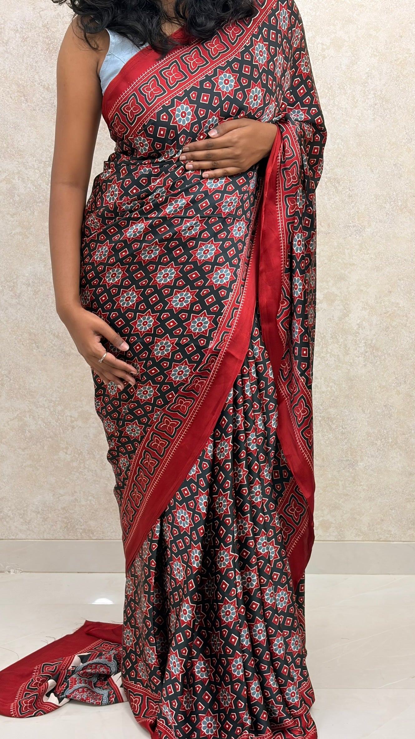 Saree-clad woman in Ajrakh Twilight Modal Silk, exuding timeless charm