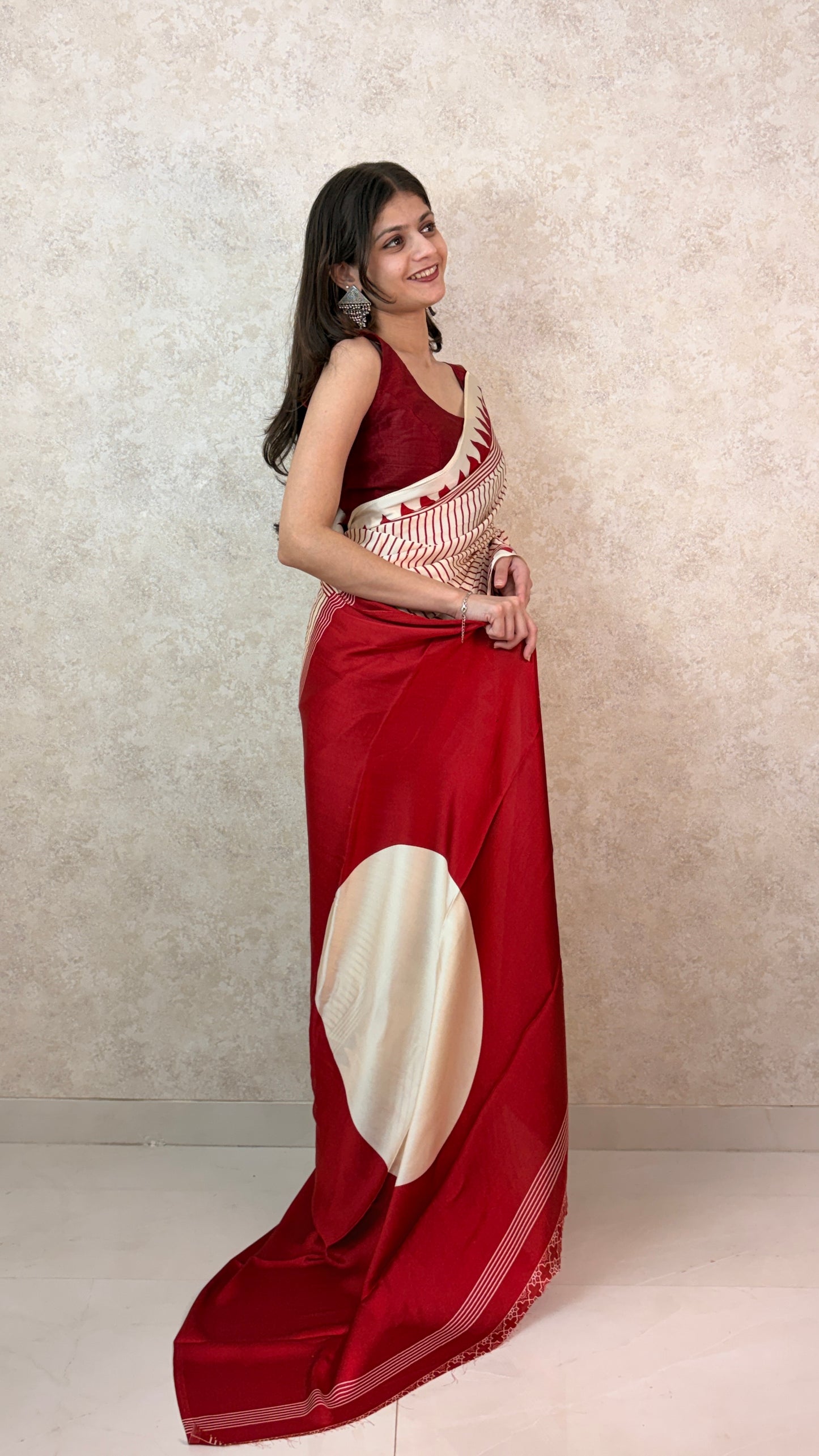 Model draped in Verti-cool Modal Sari, featuring sleek vertical patterns and elegant flair