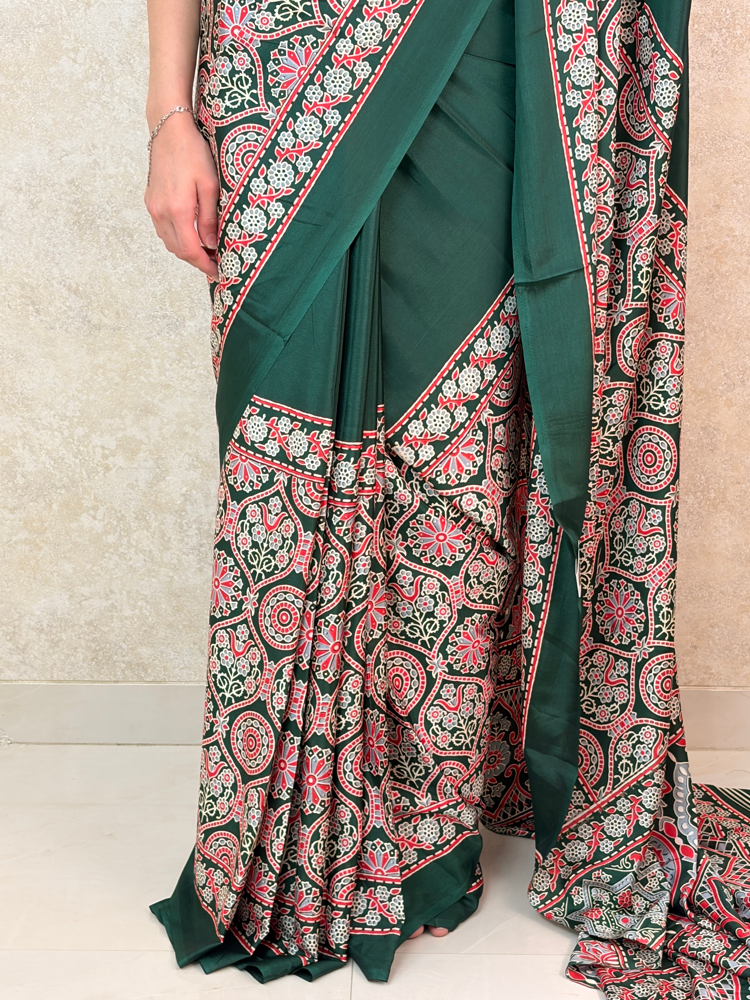 Graceful pose in Modal Silk Saree with intricate Ajrakh motifs and rich twilight tones
