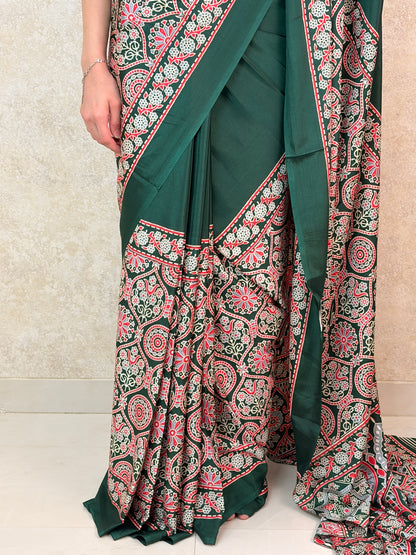 Graceful pose in Modal Silk Saree with intricate Ajrakh motifs and rich twilight tones