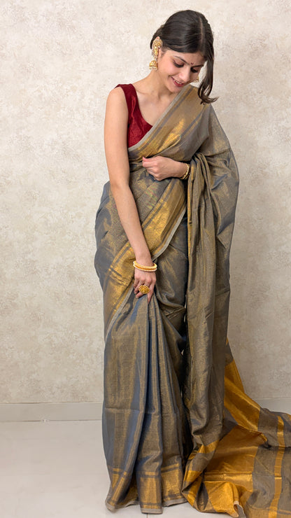 Model draped in Golden Khadi Tissue Saree, showcasing handcrafted texture and luminous charm