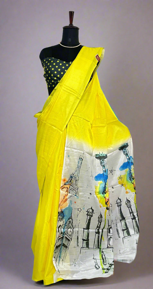 Lemon yellow cotton saree with printed pallu and crisp pleats—capturing global heritage and festive finesse