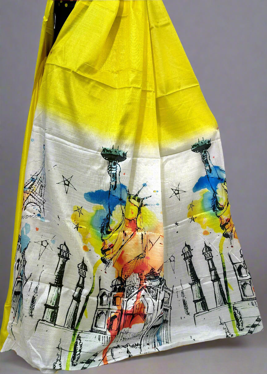 Close-up of Seven Wonders print on lemon yellow cotton saree—highlighting artistic motifs and lightweight weave.