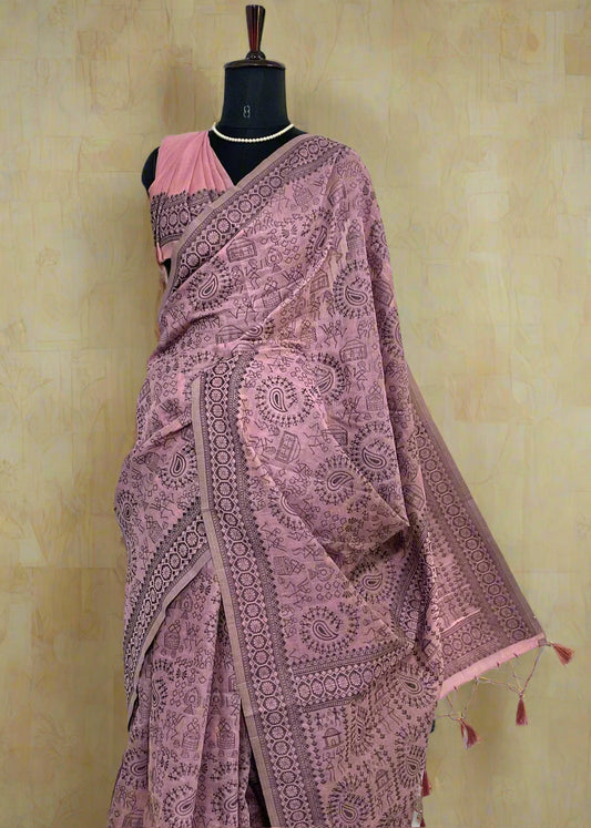 Maniqueen wearing soft pink cotton saree with Warli embroidery—styled for graceful movement and folk-inspired elegance.