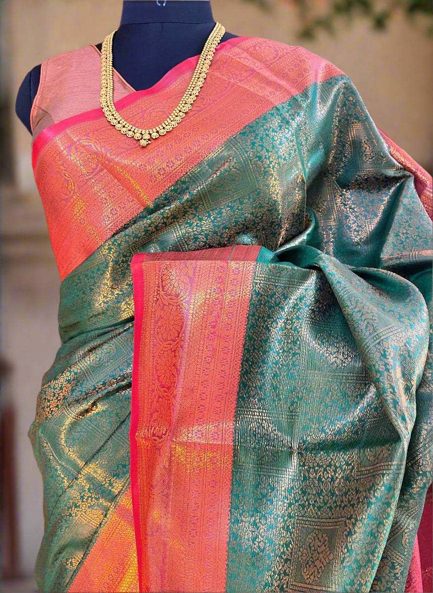 Mysore semi silk green saree with flowing pallu and contrast red border—capturing graceful movement and temple-inspired elegance.