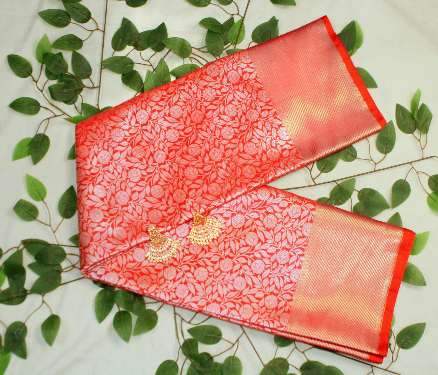 Red saree from Elite Threads—evoking regal charm with rich fabric, copper zari, and Nita Ambani–inspired grandeur.