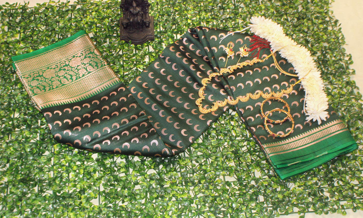 Dark green Chandrakor Butta saree with crescent motifs—styled for graceful movement and earthy elegance.