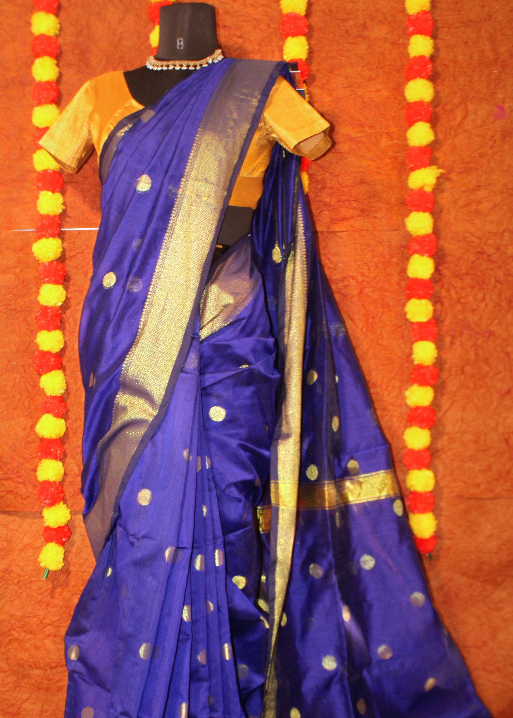 Maniqueen wearing blue Maheshwari cotton silk saree with delicate butta motifs and signature zari border—styled for festive grace and heritage elegance.