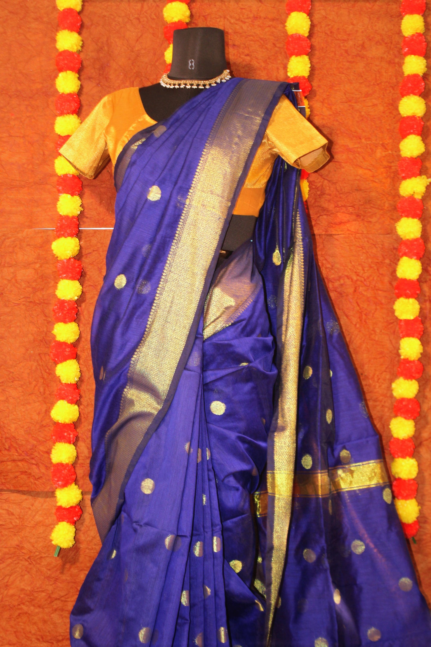 Close-up of butta motifs on blue Maheshwari cotton silk saree—highlighting intricate weave and artisanal finesse
