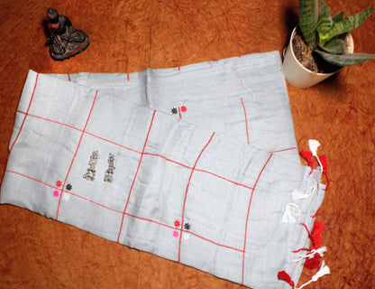 Close-up of pastel checks on grey cotton saree—highlighting tonal balance and refined detail