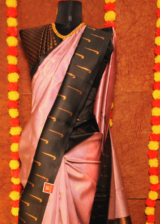 Woman wearing semi Kanchi silk saree with Muniya butta border and contrast pallu—styled for festive rituals, temple visits, and graceful gatherings.