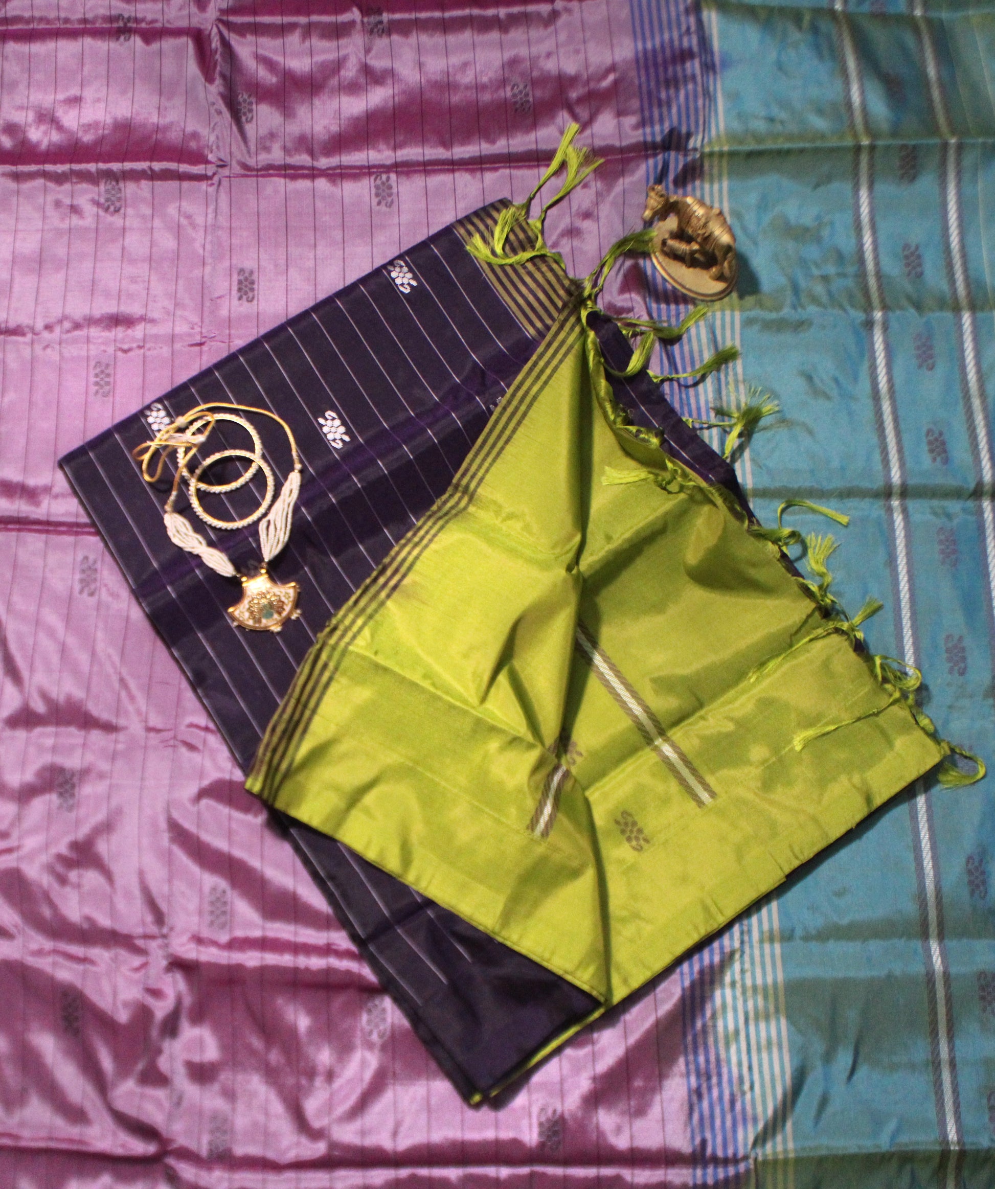 Violet Banana Pith saree adorned with Resham embroidery and striking contrast pallu—perfect for regal occasions and evening wear.