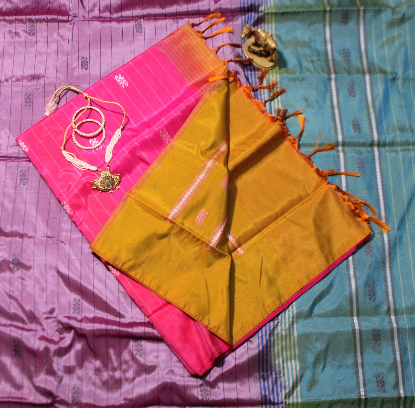 Dark pink Banana Pith saree with linear Resham work and vivid contrast blouse—blending festive vibrance with handcrafted finesse