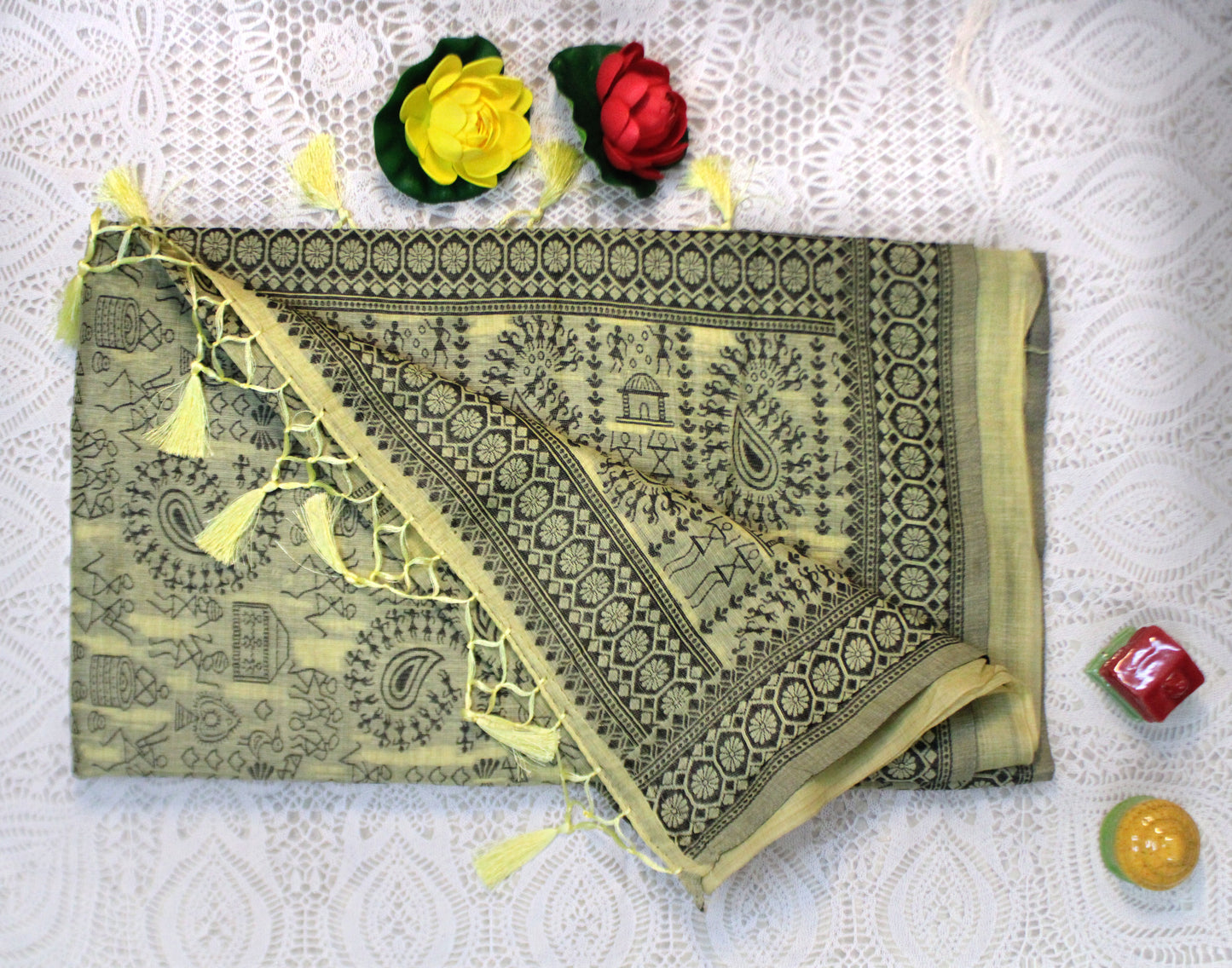 Yellow cotton saree with Warli embroidery—styled for vibrant celebration and cultural elegance.